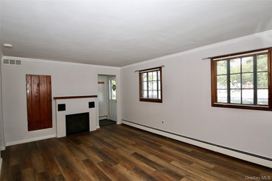 Welcome to this charming 4 bedroom, 2 bath Cape, ideally located - photo 3