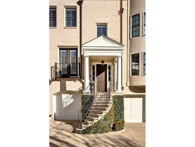 This beautifully renovated townhome offers refined living across