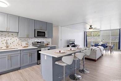 Welcome to this beautifully renovated top-floor condo in the - photo 1