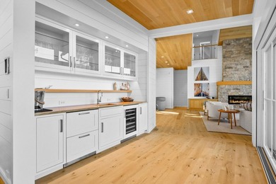 Nestled above the shimmering waters of Bassing Harbor, this - photo 11