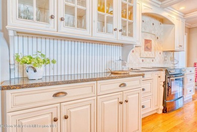 Perched on a commanding 4.5-acre hilltop, this magnificent brick