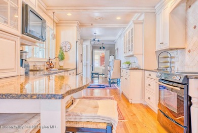 Perched on a commanding 4.5-acre hilltop, this magnificent brick