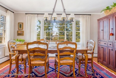 Perched on a commanding 4.5-acre hilltop, this magnificent brick