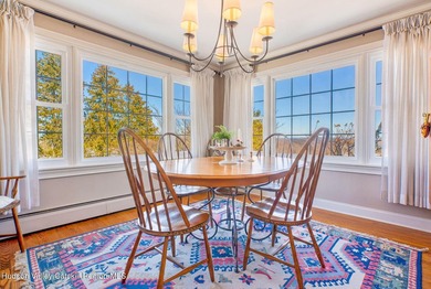 Perched on a commanding 4.5-acre hilltop, this magnificent brick