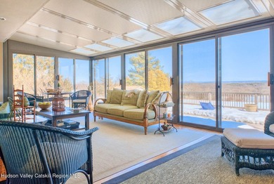 Perched on a commanding 4.5-acre hilltop, this magnificent brick