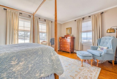 Perched on a commanding 4.5-acre hilltop, this magnificent brick