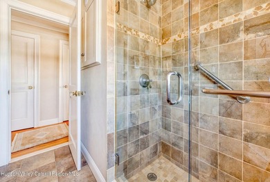 Perched on a commanding 4.5-acre hilltop, this magnificent brick