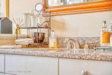 Perched on a commanding 4.5-acre hilltop, this magnificent brick