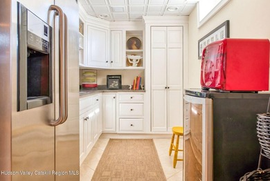 Perched on a commanding 4.5-acre hilltop, this magnificent brick