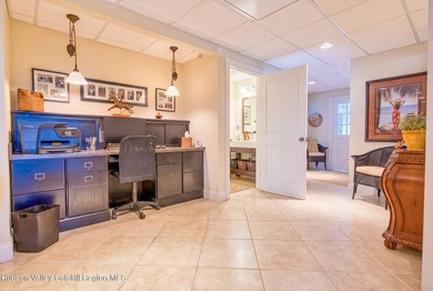 Perched on a commanding 4.5-acre hilltop, this magnificent brick