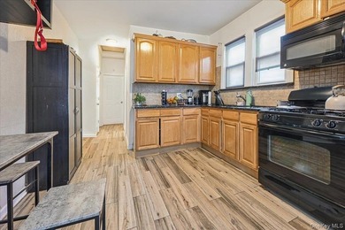 Don't miss this exceptional two-family home in the heart of the - photo 8