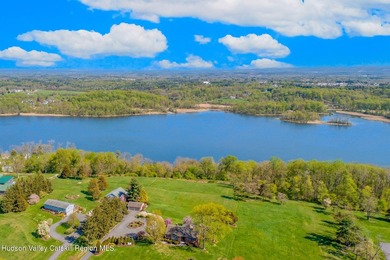 Perched on a commanding 4.5-acre hilltop, this magnificent brick