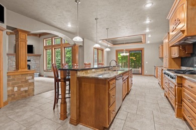 Well-maintained no-step home on a wooded cul-de-sac lot with