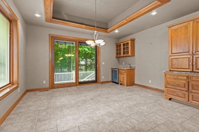 Well-maintained no-step home on a wooded cul-de-sac lot with