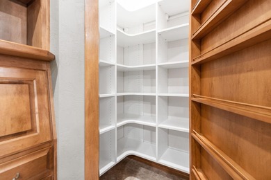 Well-maintained no-step home on a wooded cul-de-sac lot with