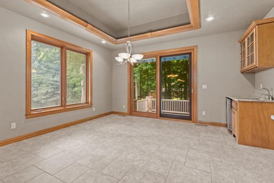 Well-maintained no-step home on a wooded cul-de-sac lot with