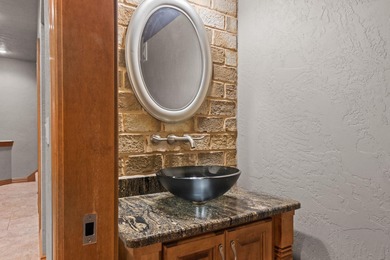 Well-maintained no-step home on a wooded cul-de-sac lot with