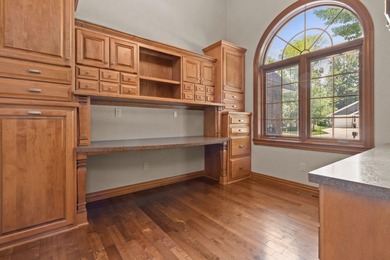 Well-maintained no-step home on a wooded cul-de-sac lot with