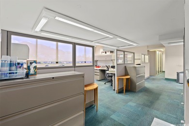 Space is currently configured as a large office with reception