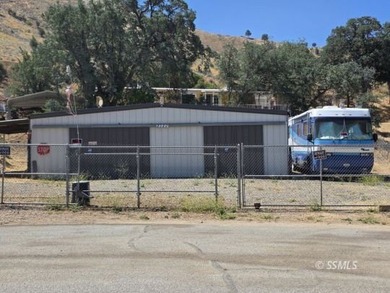 Perched on the high point of the parcel, this manufactured home - photo 1