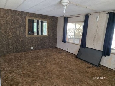 Perched on the high point of the parcel, this manufactured home - photo 3