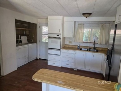 Perched on the high point of the parcel, this manufactured home - photo 7