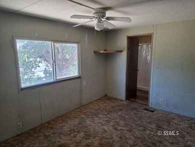 Perched on the high point of the parcel, this manufactured home - photo 10