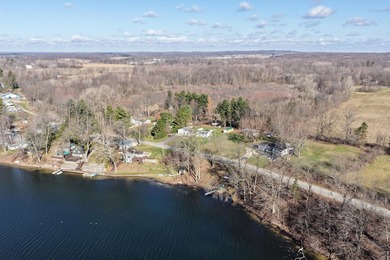 This .4 acre buildable lot includes 30 feet of lake frontage on - photo 11