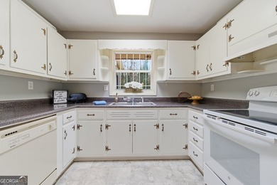 Well maintained 2 bedroom, 1.5 bath ranch featuring hardwood