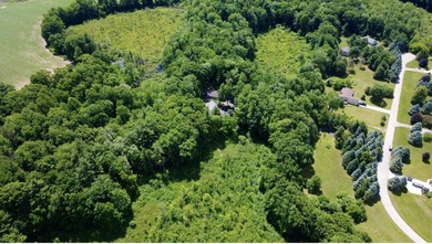 poised on 10 private, wooded acres, this exceptional 3,500+ sq - photo 47