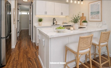 Discover this beautifully-remodeled high-floor unit in the - photo 1
