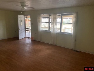 Great buy on a 2,000 sq ft home (3 bdrm/2 bath) fronting scenic