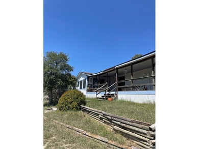 Peaceful country living with two homes on this 8.5 acres. Main