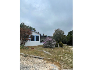 Peaceful country living with two homes on this 8.5 acres. Main