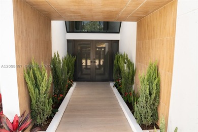 Exquisite modern estate located in the prestigious Village of - photo 5