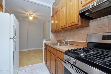 LOCATED IN THE HEART OF MIDWOOD, ON A BEAUTIFUL TREE-LINED