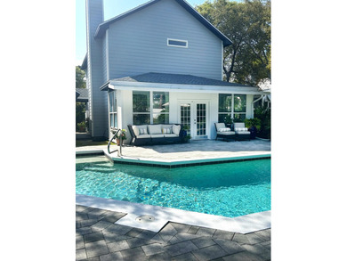 Just steps from the sugar-white sands and emerald waters that - photo 50