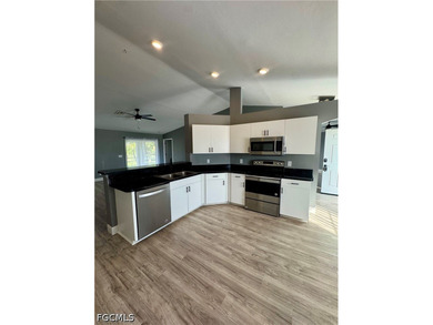 COME CHECK OUT THIS BEAUTIFULLY UPDATED home located in the - photo 4