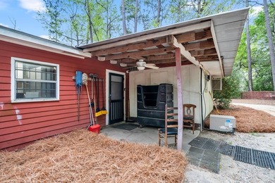 Tucked beneath a canopy of towering trees and vibrant azaleas - photo 49