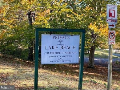 Nice wooded lot located in a well sought after waterfront - photo 4
