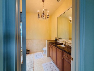 Commanding serene lakefront and double fairway vistas, this - photo 25