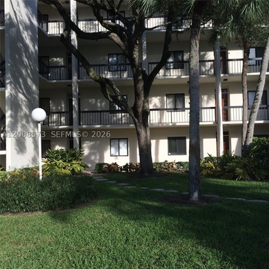 First-floor condo located in a gated golf community with a 24H - photo 1