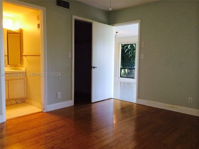 First-floor condo located in a gated golf community with a 24H - photo 5