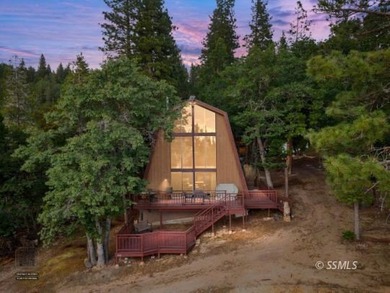 This extremely well-maintained home is nestled within the - photo 1