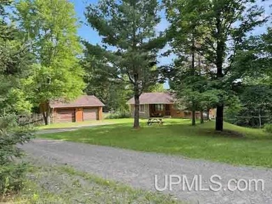 Tucked away on a quiet dead end road, this peaceful riverfront - photo 3