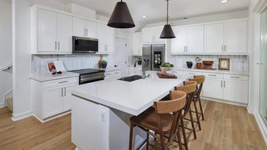 This home is a former model with an upgraded backsplash and - photo 5