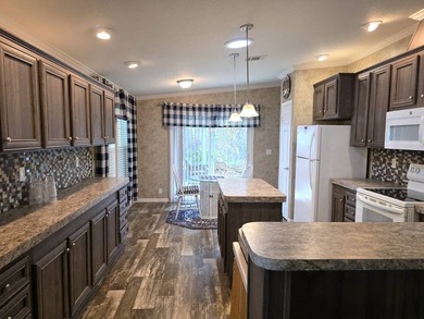 THIS HOME IS ON LEASED LAND WITH A MONTHLY LOT OF $435 AND THAT - photo 14
