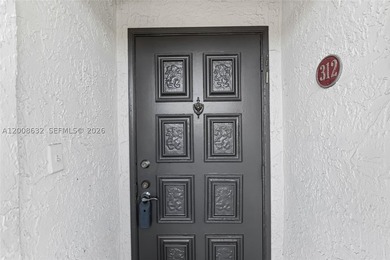 Welcome to this well-maintained condo located at 5900 NW 44th St - photo 4