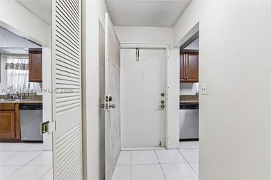 Welcome to this well-maintained condo located at 5900 NW 44th St - photo 5