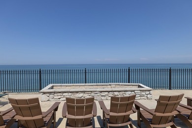 This 20,000-square-foot lot overlooking Lake Michigan is part of - photo 9